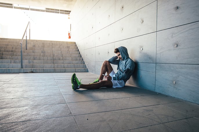 Man sitting and looking at phone