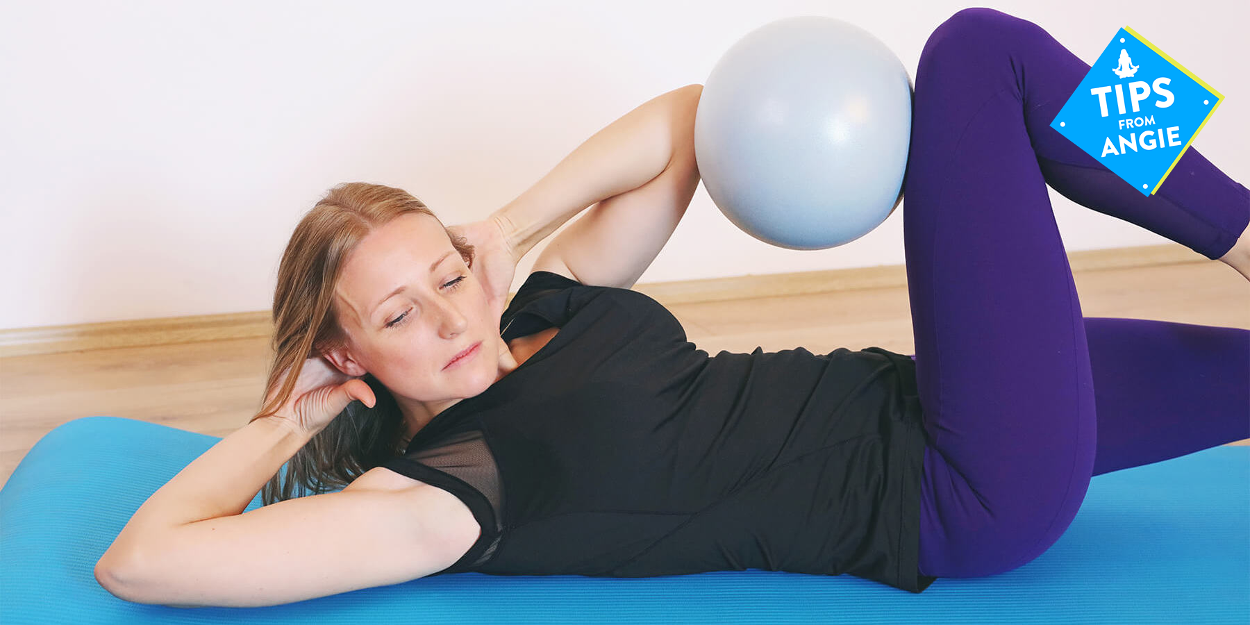 Woman doing core exercise with small stability ball