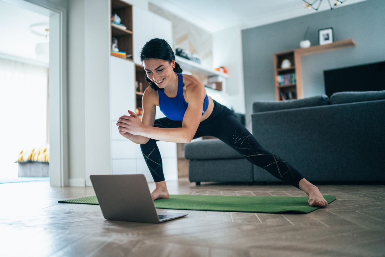 Online group fitness teacher demonstrating exercise for client