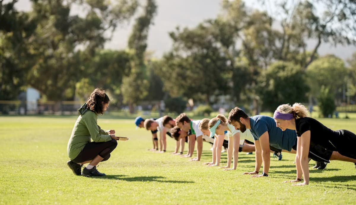 a group fitness instructor teaching a class outside